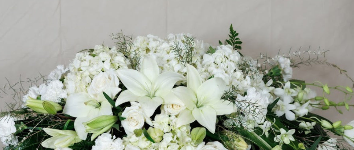 Elegant, formal White Casket Spray