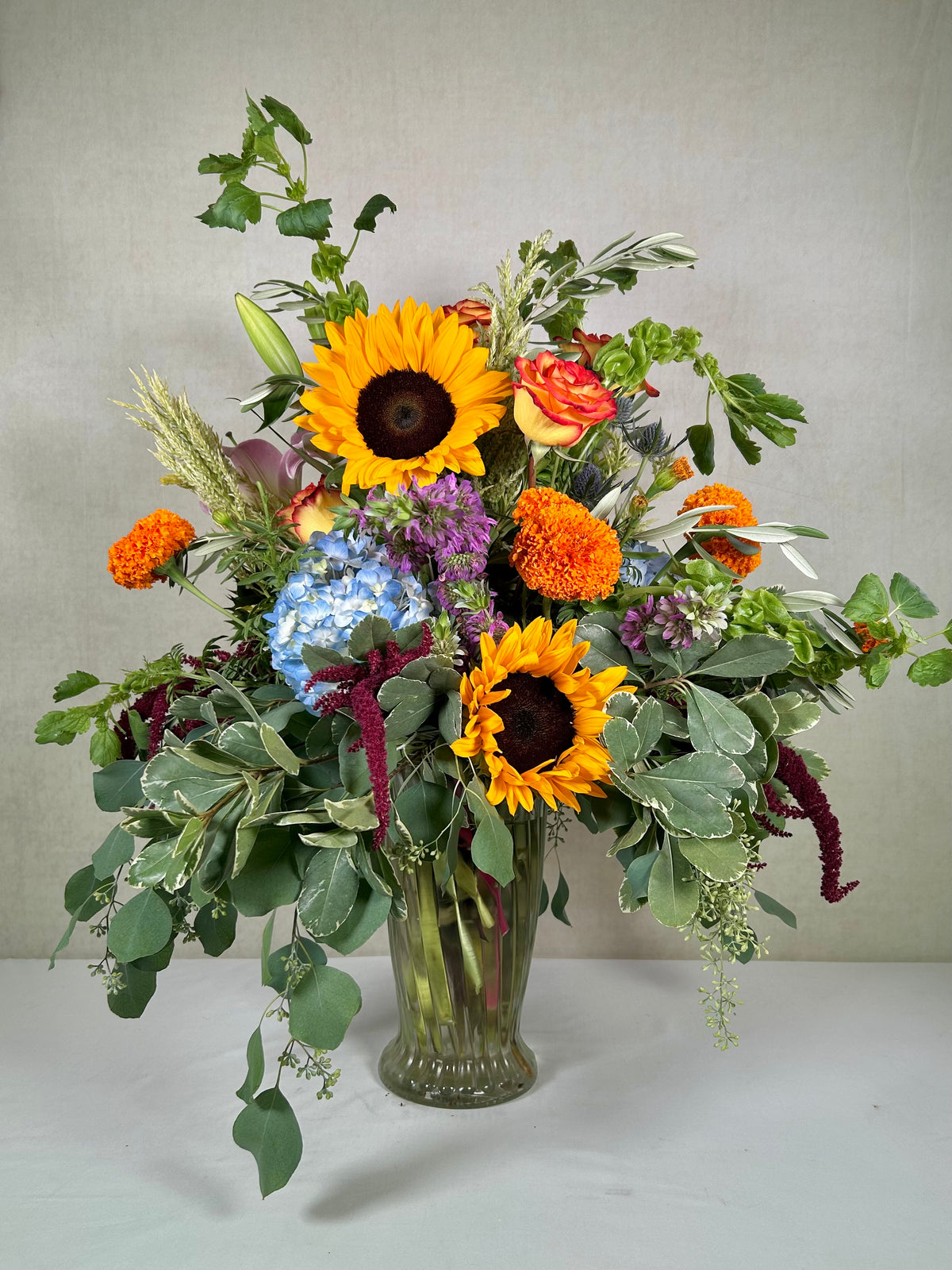 Dramatic Array of Colorful Florals Sympathy Arrangement