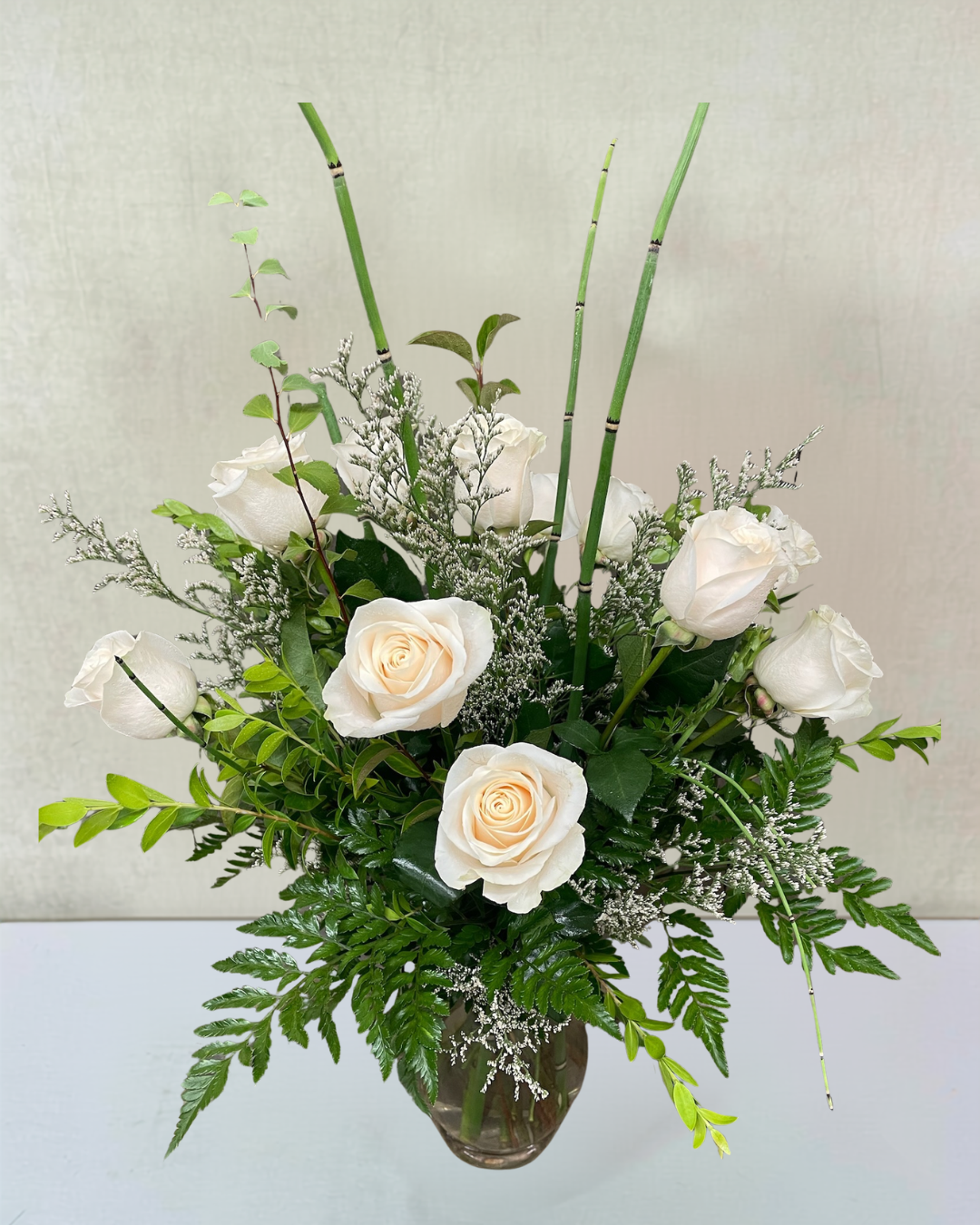 Lovely Sentiment of White Roses Sympathy Arrangement