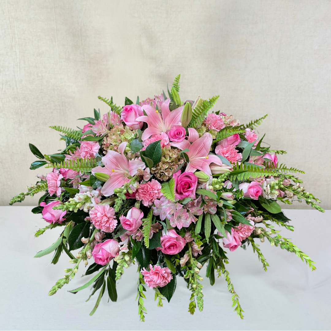 Priceless Pink Roses and Lilies Casket Spray