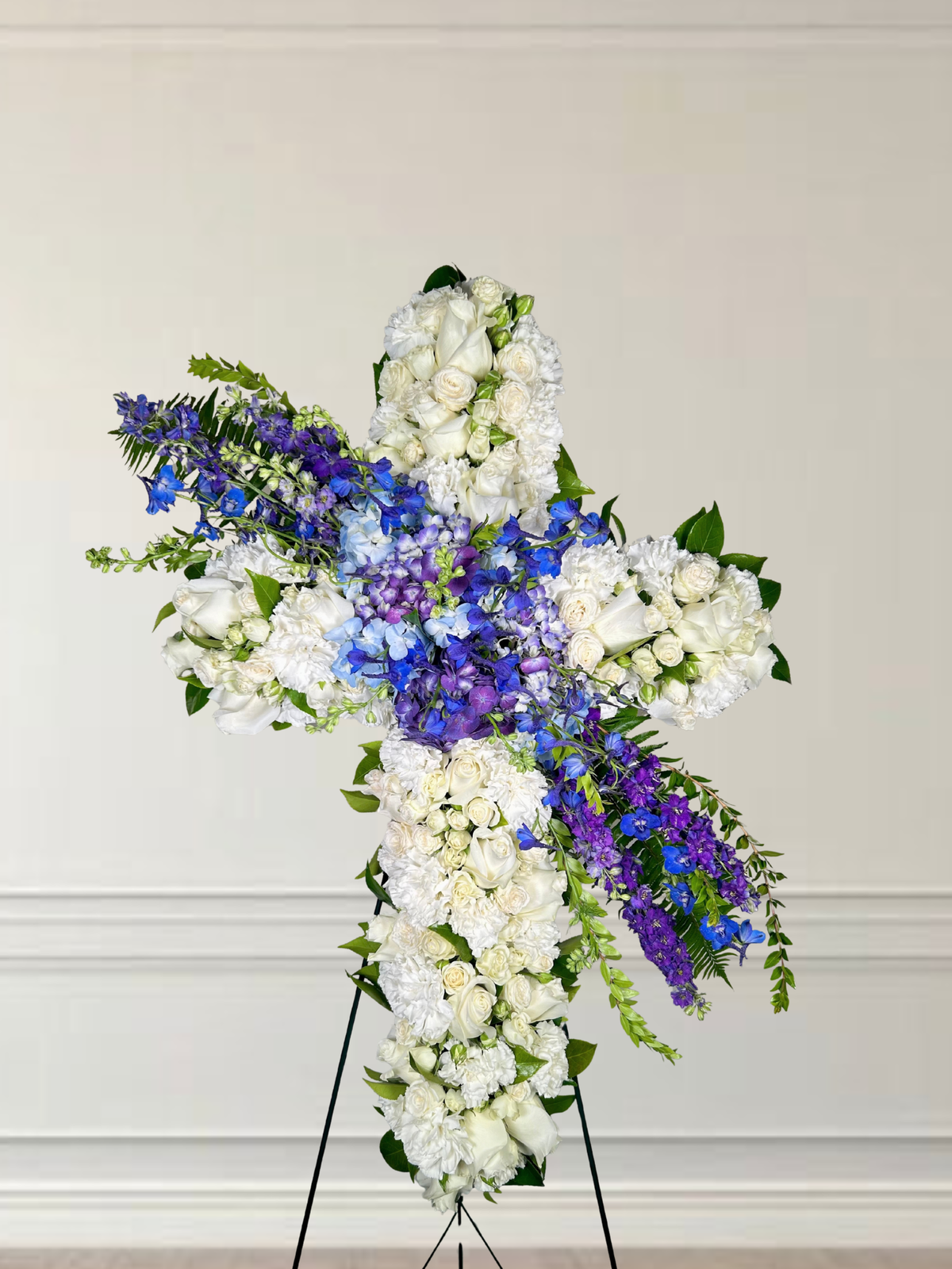 White Sympathy Cross with Blue and Purple Spray